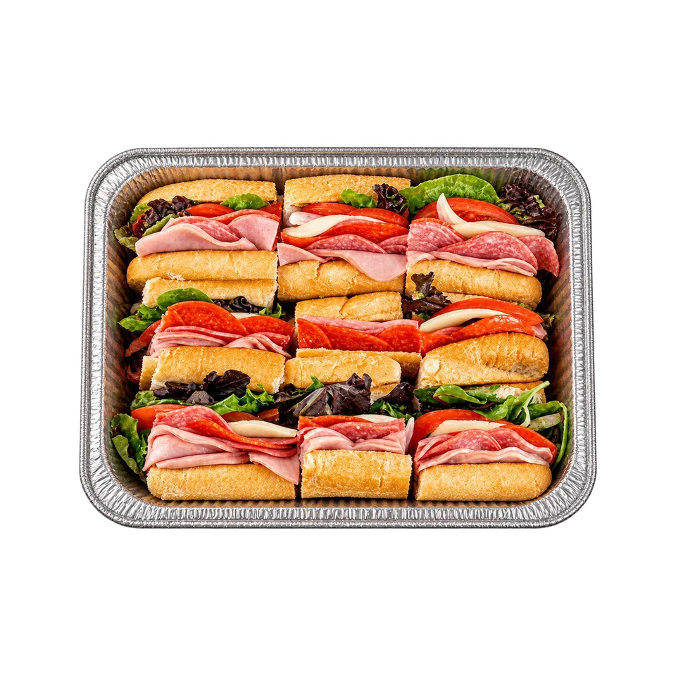 A foil catering tray filled with hoagie sandwiches