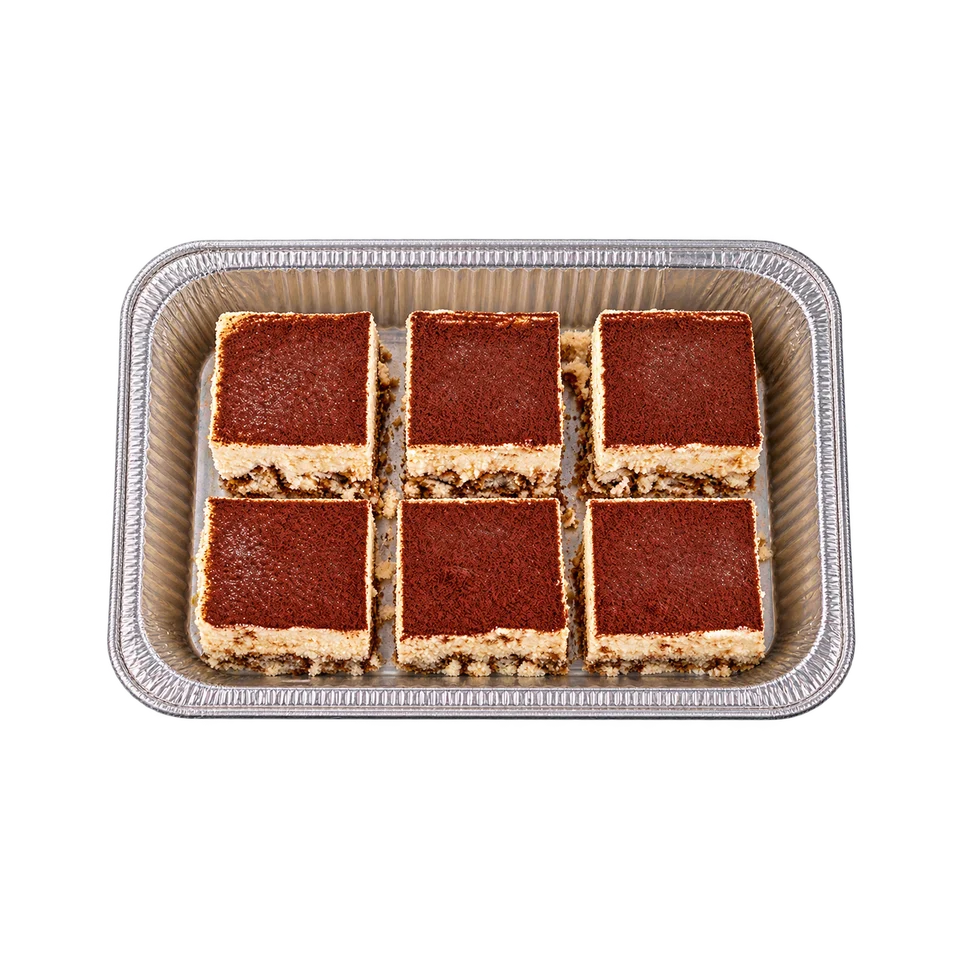Individual cocoa-dusted tiramisu portions arranged in a foil catering tray